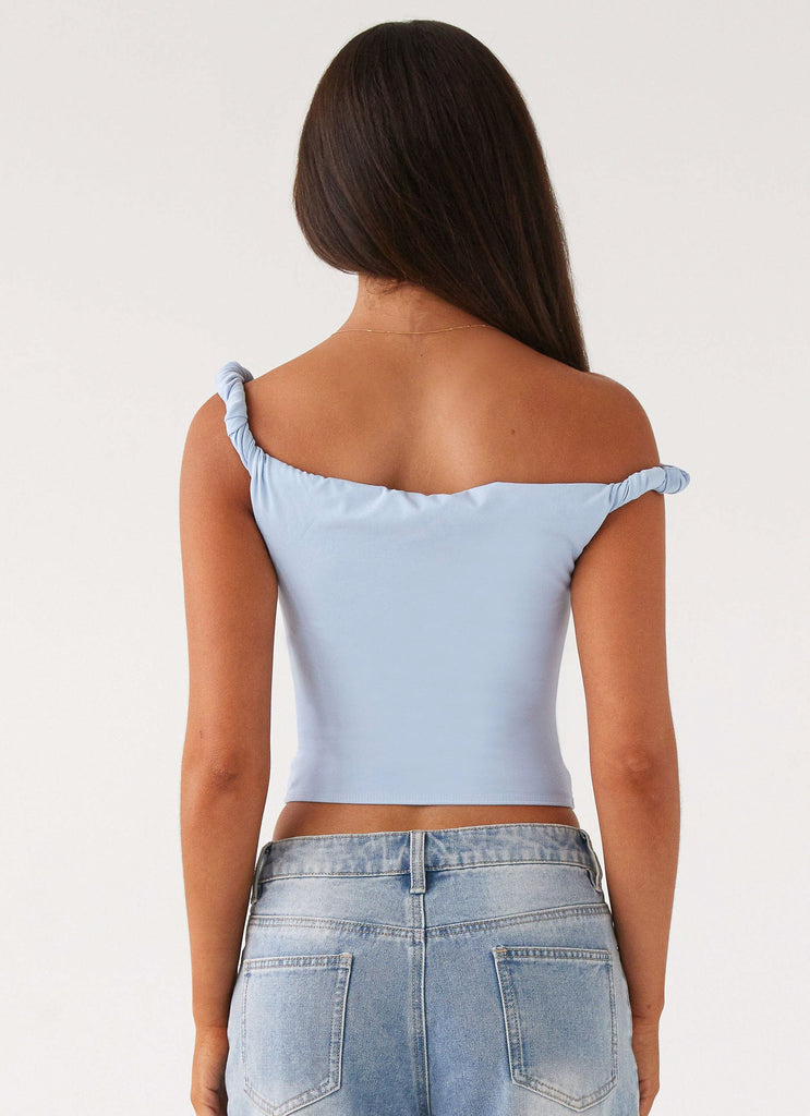 Womens Solace Soul Twist Shoulder Top in the colour Baby Blue in front of a light grey background