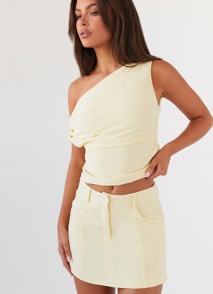 Womens Marissa Linen Mini Skirt in the colour Lemon in front of a light grey background