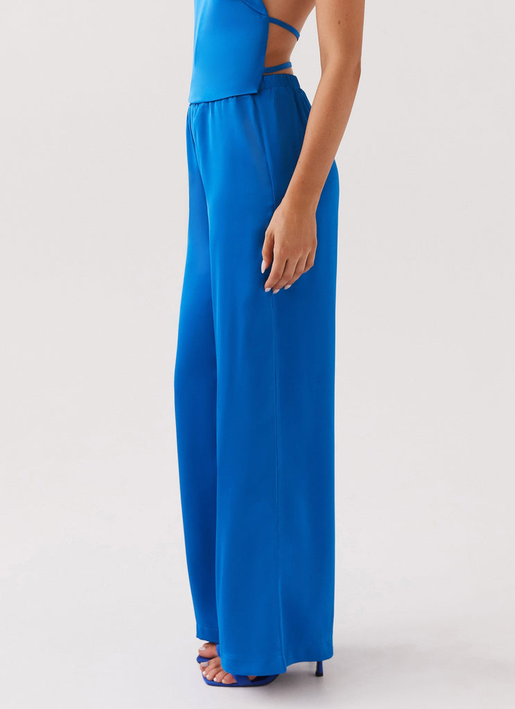 Womens Palm Cove Satin Pants in the colour Cobalt in front of a light grey background