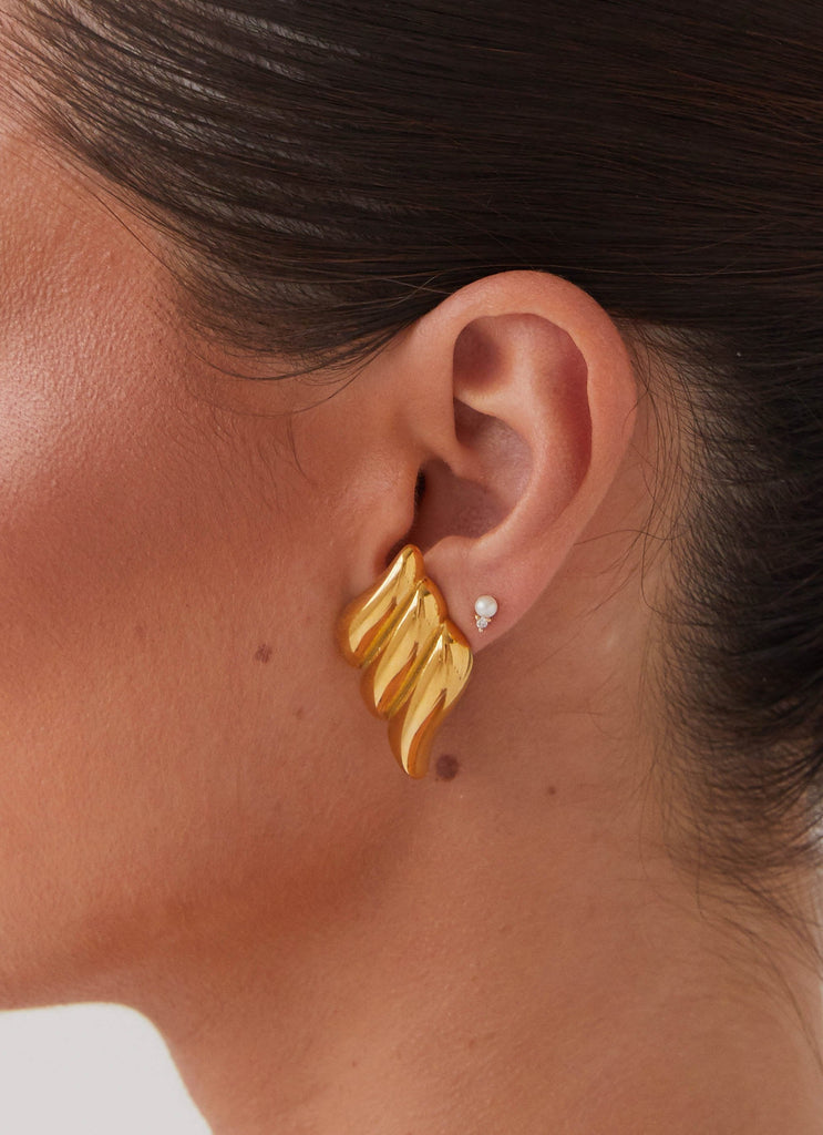 Womens Eileen Earrings in the colour Gold in front of a light grey background