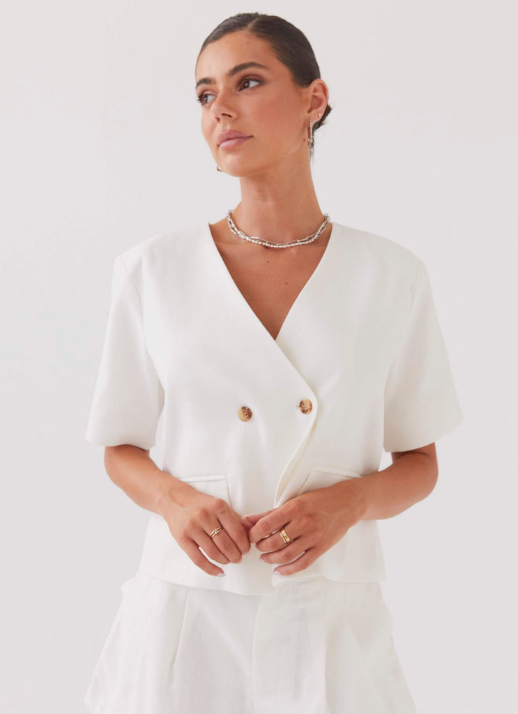 Womens Hacienda Linen Short Sleeve Blazer in the colour White in front of a light grey background