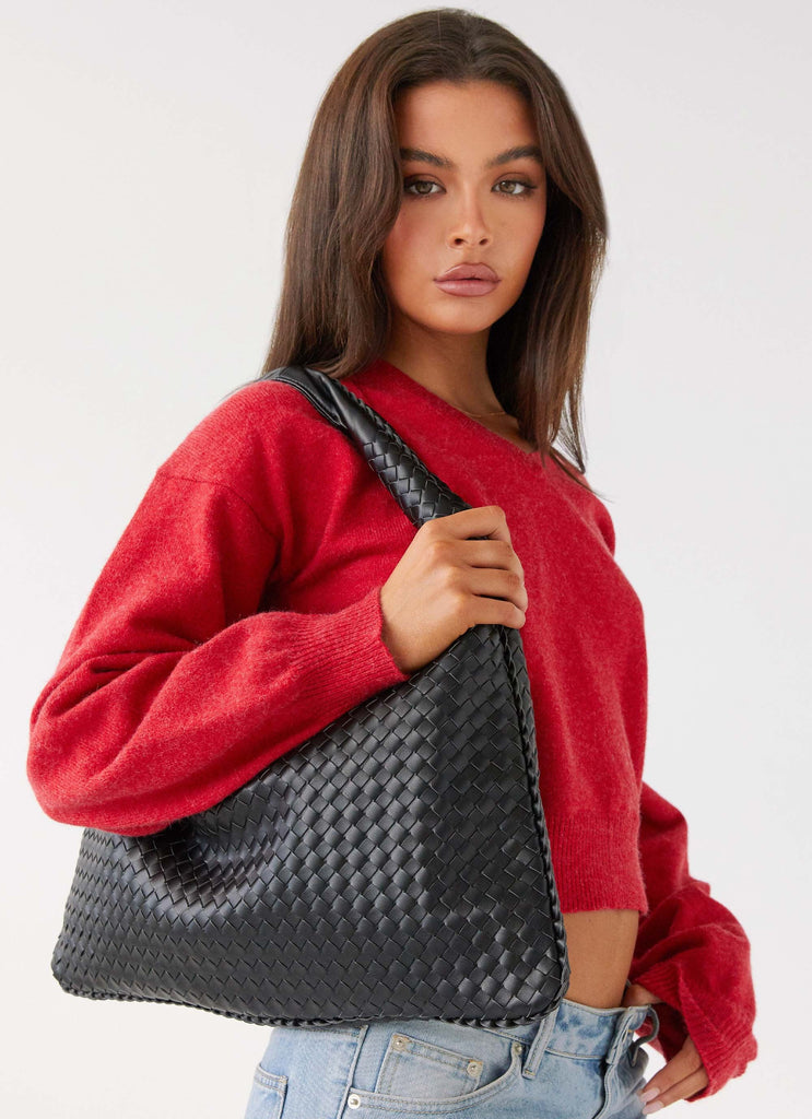 Womens Hacie Shoulder Bag in the colour Black in front of a light grey background