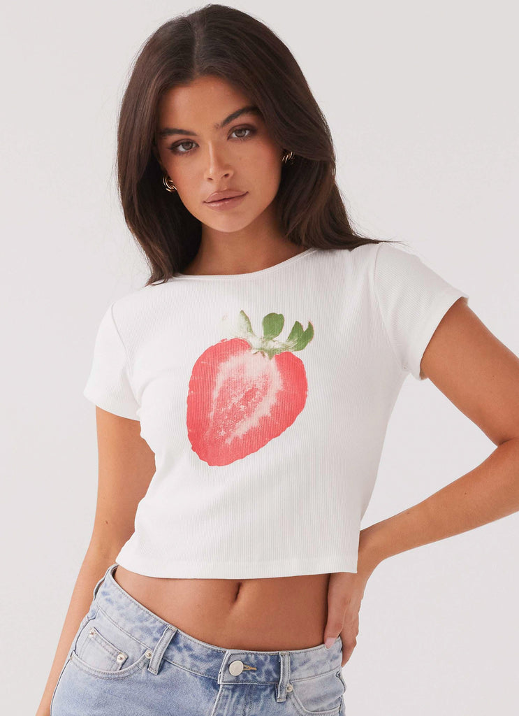 Womens Strawberry Shortcake Graphic Baby Tee in the colour White in front of a light grey background