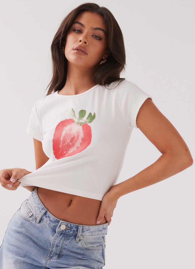 Womens Strawberry Shortcake Graphic Baby Tee in the colour White in front of a light grey background