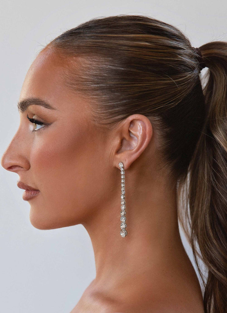 Womens Elixir Diamante Earrings in the colour Silver Stone in front of a light grey background