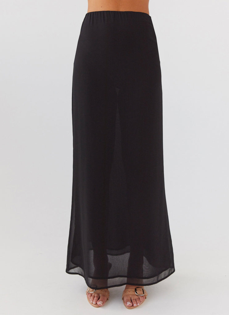 Womens Nightfall Maxi Skirt in the colour Midnight in front of a light grey background