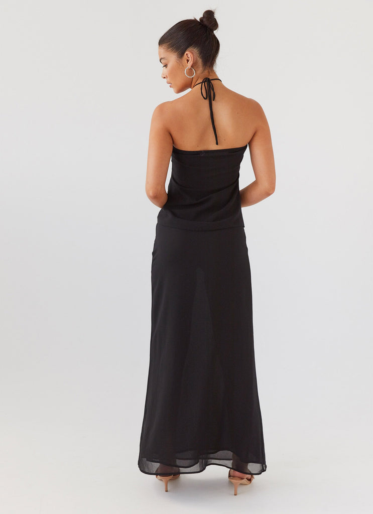 Womens Nightfall Maxi Skirt in the colour Midnight in front of a light grey background