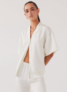 Womens Palm Cove Satin Shirt in the colour Pearl Dove in front of a light grey background