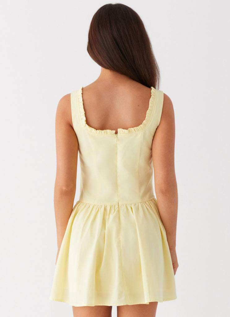 Womens Wren Mini Dress in the colour Yellow in front of a light grey background